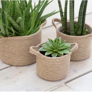 Set of three jute woven planter baskets in small, medium, and large sizes, perfect for plants or storage.