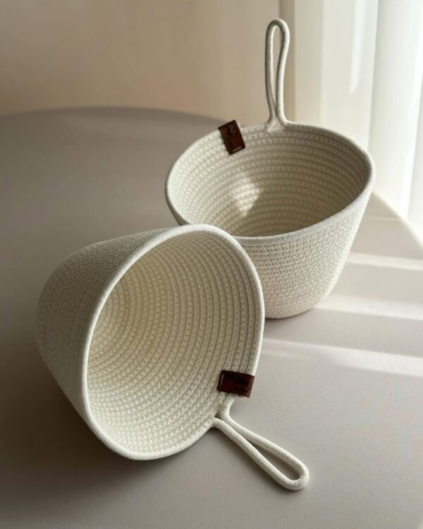 Set of 2 cotton rope planter baskets with a 6-inch diameter, featuring a convenient hanging loop for versatile use."