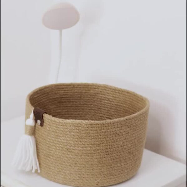 ute storage basket, eco-friendly jute basket, handcrafted jute organizer, bathroom storage basket, natural jute decor, tassel jute basket, rustic storage bin, compact jute basket, home organization jute basket, small storage basket for toiletries