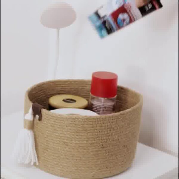 ute storage basket, eco-friendly jute basket, handcrafted jute organizer, bathroom storage basket, natural jute decor, tassel jute basket, rustic storage bin, compact jute basket, home organization jute basket, small storage basket for toiletries