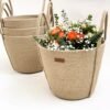 Handcrafted jute planter basket with handles Eco-friendly jute plant holder Stylish indoor planter basket Natural jute rope plant pot cover Rustic decorative planter basket Large jute planter with handles Small eco-friendly plant basket Indoor plant decor basket Boho-style jute planter Versatile jute basket for plants