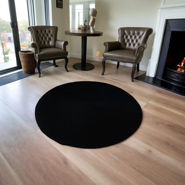 black cotton rope rug Pakistan cotton round rug online Pakistan handmade round rug for living room black circular floor mat Pakistan minimalist cotton rug Pakistan braided cotton rug Pakistan boho style round rug in Pakistan washable cotton rope rug cotton floor mat Pakistan black round rug for living room