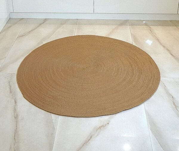 Handcrafted brown cotton rope rug in a cozy room near a fireplace, perfect for rustic or modern home decor jute rug brown cotton rope rug round cotton rug eco-friendly rug